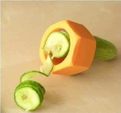 Cucumber being cut in Spiral shape by a high quality yellow vegetable Spiral slicer