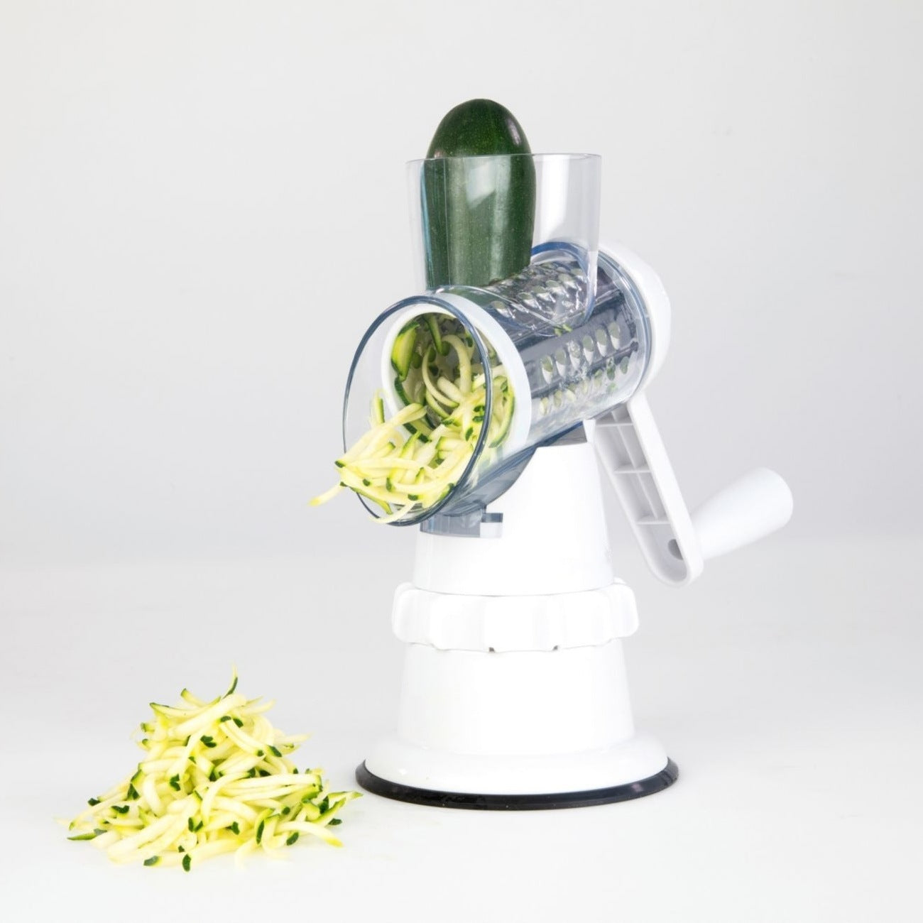  Vegetable cutter process cucumber into shredded pieces as shown in a small glass bowl