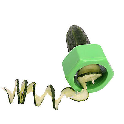 Cucumber being cut in Spiral shape by a high quality green vegetable Spiral slicer
